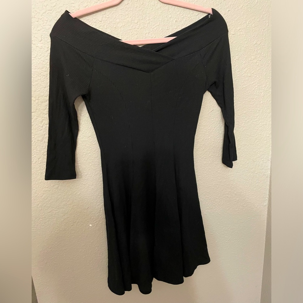 Black mini dress, flare skirt.